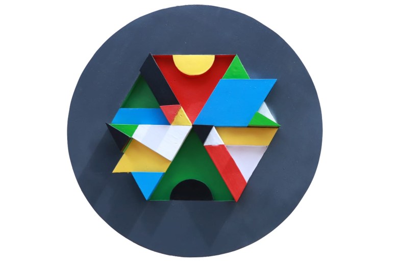 Sculptural wall piece titled "Isinyolovane I" (2020), made with spray paint on pine wood, featuring layered, abstract markings that evoke indigenous codes and street art aesthetics.